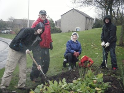 Digging Community flowerbeds in Cove